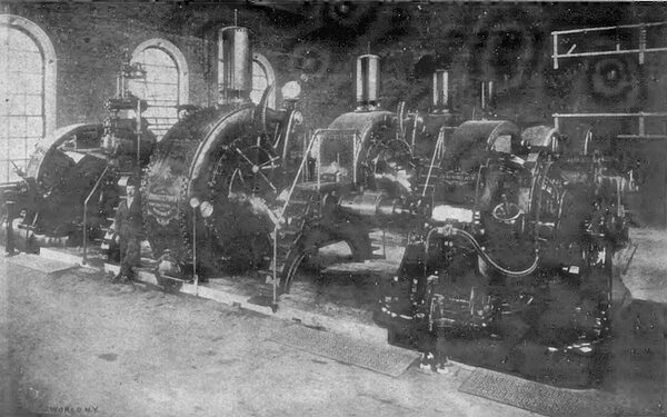 Fig. 4.NEW POWER PLANT OF THE NIAGARA FALLS HYDRAULIC POWER & MANUFACTURING COMPANY, SHOWING TURBINES, GOVERNOR AND STREET RAILWAY GENERATORS.