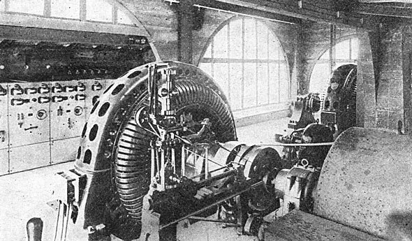 FIG. 3.VIEW IN POWER HOUSE, SHOWING ALTERNATORS AND WATER WHEEL GOVERNORS.