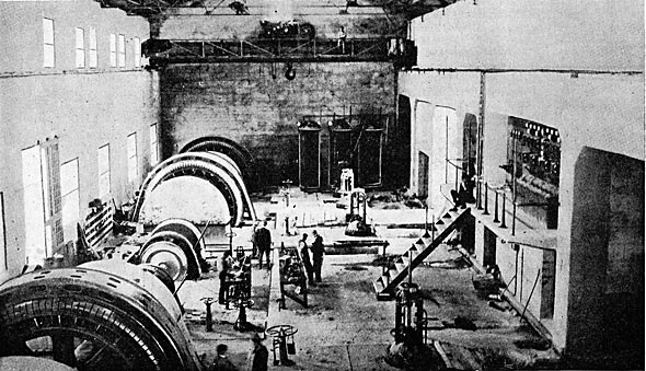 FIG. 22.  INTERIOR VIEW OF POWER HOUSE SHOWING THREE MAIN UNITS AND ONE OF THE EXCITER UNITS.