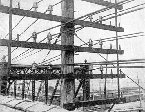 FIG. 2  -  CLAMP INSULATORS ON WOODEN PINS.