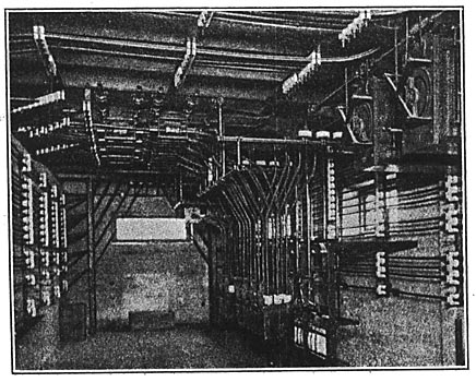 FIG. 14.  OIL SWITCHES AND REGULATORS IN BASEMENT OF SUB-STATION NO. 1
