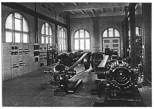 FIG 10.  A VIEW OF THE CENTRAL STATION BAY, SHOWING INDUCTION MOTORS BELTED TO ARC DYNAMOS AND ALTERNATORS.