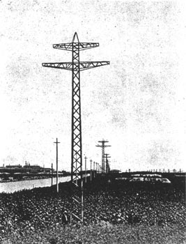 FIG. 5. VIEW OF LOCKPORT-CHICAGO TRANSMISSION LINE, WITH SUB-STATION IN THE DISTANCE.