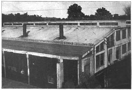 Fig. 28. Reinforced Concrete Factory — Exterior View, showing temporary end, as arranged for coal storage.