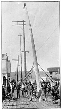 EIGHT MEN ARE ALL THAT ARE REQUIRED TO RAISE A 60-FOOT POLE.