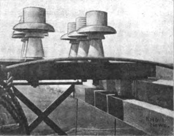 FIG. 13. SADDLE INSULATORS IN PLACE ON TOWER.