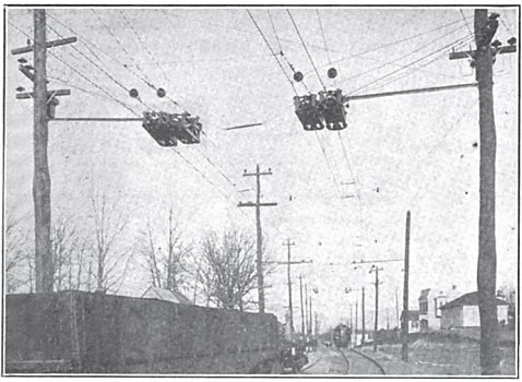 SECTION INSULATORS AT DISTRICT LINE IN WASHINGTON WHERE THE SINGLE-PHASE SYSTEM CONNECTS WITH THE DOUBLE TROLLEY DIRECT-CURRENT SYSTEM.