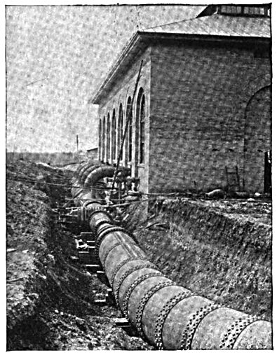FIG. 2 — EXTERIOR OF POWER HOUSE, SHOWING ONE VENTURI METER AND RECEIVER.
