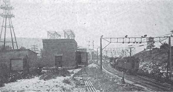 FIG. 7—VIEW OF SWITCH HOUSE AND OVERHEAD CONSTRUCTION AT WEST PORTAL