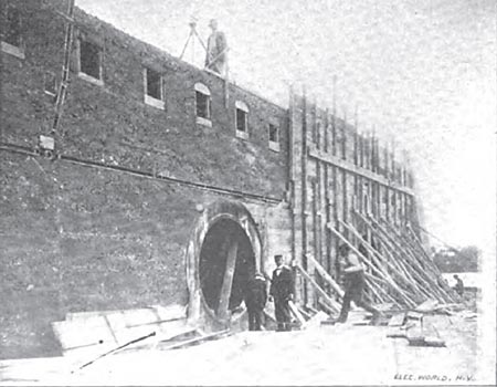 BUILDING THE UPPER STEP OF POWER-HOUSE DAM, SHOWING MANHOLE TO FLUME AND ENTRANCES TO CABLEWAYS.