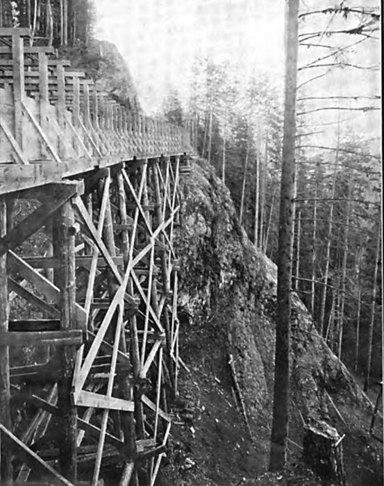 FLUME LINE THROUGH THE ROCK CANYON OF THE PUYALLUP RIVER.