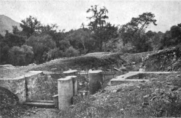 PHOTOGRAPH NO. 10. THE SETTLING BASIN AND SUBMERGED WEIR, FROM DOWN - STREAM, DURING CONSTRUCTION