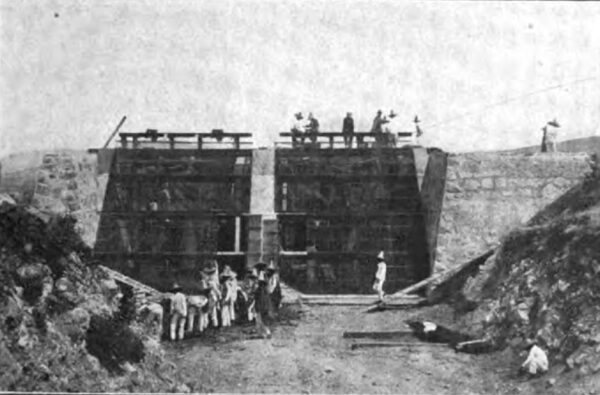 PHOTOGRAPH NO. 18. THE MASSIVE MASONRY PENSTOCK AND SCREEN DURING CONSTRUCTION