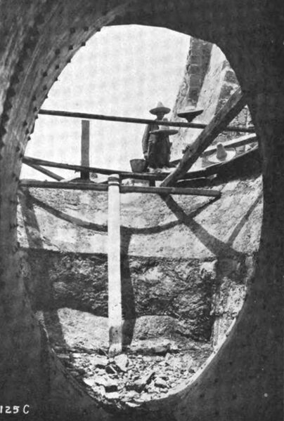 PHOTOGRAPH NO. 20. LOOKING OUT THROUGH THE MOUTH OF THE GREAT OVAL TAPER SECTION DURING THE CONSTRUCTION OF THE PENSTOCK