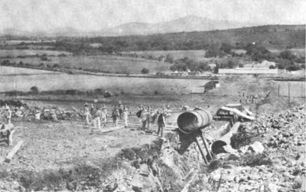 PHOTOGRAPH NO. 22. LAYING THE PRESSURE PIPE