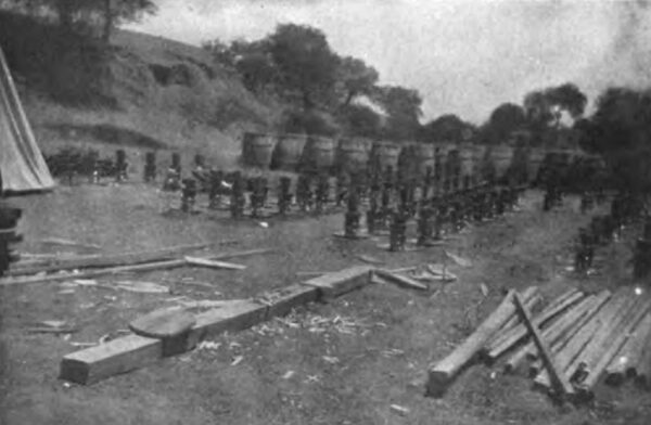 PHOTOGRAPH NO. 41. CEMENTING TOGETHER THE INSULATOR PARTS AND THE PINS. A. READY FOR THE NEAT CEMENT