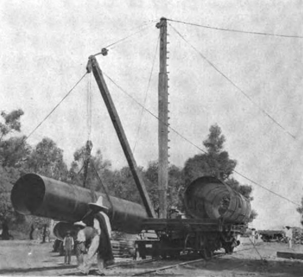 PHOTOGRAPH NO. 63. UNLOADING PIPE SECTIONS AT ZAMORA