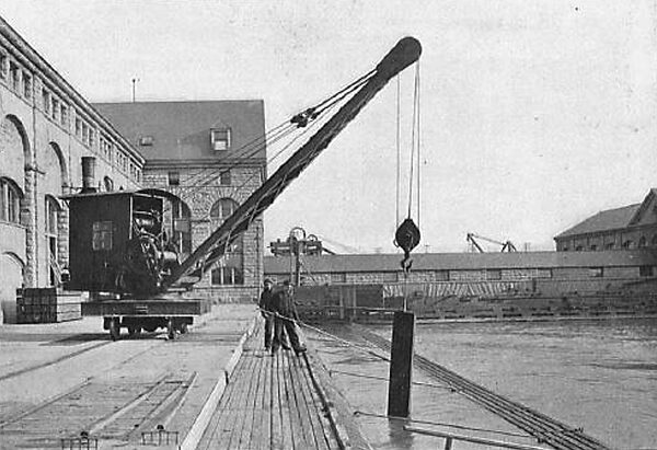 REMOVING A SECTION OF THE INLET RACKS BY MEANS OF A LOCOMOTIVE CRANE TO ALLOW ANCHOR ICE TO PASS THROUGH