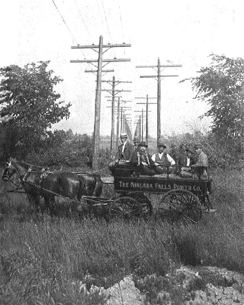 A STRAIGHT-AWAY STRETCH OF THE TRANSMISSION LINES. EMERGENCY WAGON AND CREW IN FOREGROUND