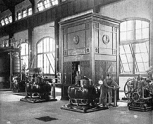 THE EXCITER PLANT AND ELEVATOR ENCLOSURE.  GOVERNOR OF UNIT NO. 5 ON THE RIGHT
