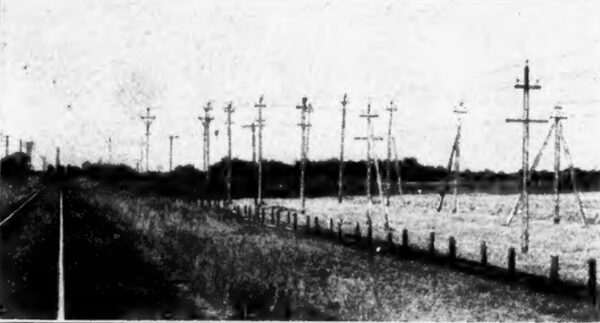 A VIEW ALONG THE POLE LINE, SHOWING ALSO STRAIN POLES.