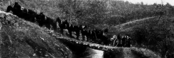 TEN-HORSE TEAM HAULING POWER-PLANT MATERIAL OVER MOUNTAINS.