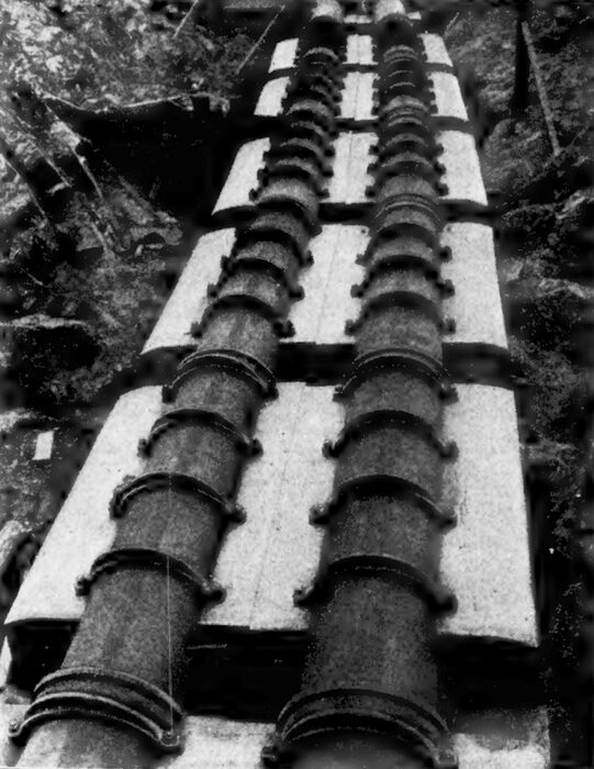 ANCHORAGES FOR THE DELIVERY PIPES AT THE FOOT OF THE 1,500-FOOT HILL, LEADING INTO THE COLGATE POWER HOUSE, UNDER 304 POUNDS PRESSURE PER SQUARE INCH.