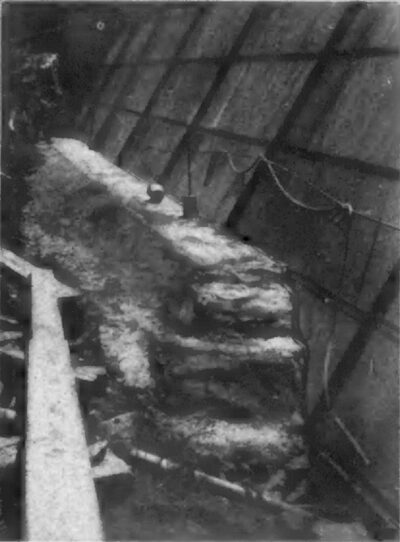 STEEL FACE OF DAM SHOWING CONCRETE CONNECTION WITH BED-ROCK.