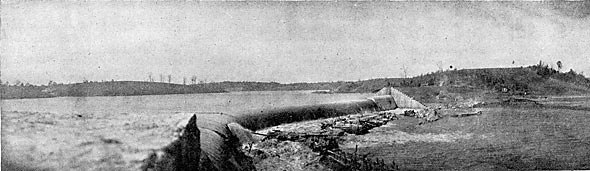 FIG. 4.  FIRST WATER OVER SPILLWAY.