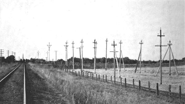 THE BAY COUNTIES TRANSMISSION LINES CARRY CURRENT AT FROM 40,000 TO 60,000 VOLTS. SOME OF THE STRAIN POLES ARE HERE ALSO SHOWN