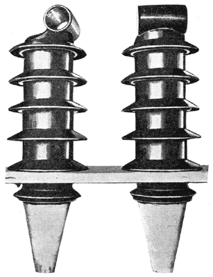 FIG. 3.  PORCELAIN BUSHINGS FOR 450,000-VOLT TRANSFORMER.