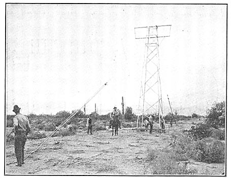 Fig. 6 - Tower Being Bolted to Anchor at the Base.