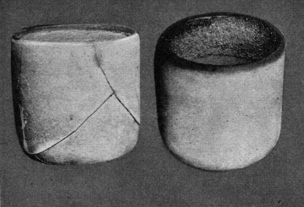 Fig. 1 -- Thin walls of porcelain test cup exaggerate cement stresses. Cups filled with neat Portland cement.