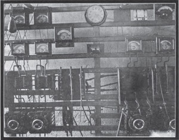THE ORIGINAL SWITCHBOARD IN THE OLD REDLANDS PLANT.  NOTE THE \"GROWLER\" UNDER THE CLOCK