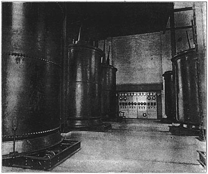 FIG. 8. On the Left are the 110,000-volt Transformers, Stepping Down to 20,000 Volts and 7,200 Volts. 72,000-volt Transformers are Seen at the Right/INTERIOR VIEW OF WEALTHY AVENUE SUB-STATION GRAND RAPIDS