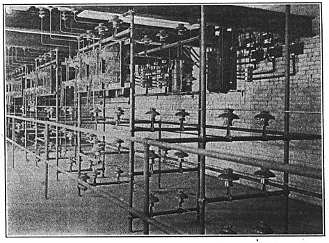 FIG. 8.  DUPLICATE HIGH-TENSION BUS-BARS IN BASEMENT OF SUB-STATION NO. 1