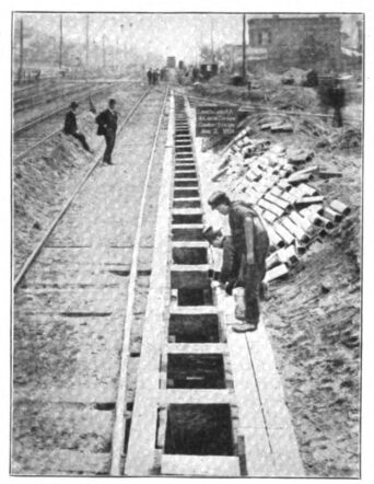 FIG. 2. CONDUIT MANHOLES CLOSE TO TRACKS ON AT-LANTIC DIVISION OF LONG ISLAND RAILROAD.