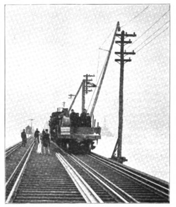 FIG 6. STRINGING CABLE ON JAMAICA BAY TRESTLE OF LONG ISLAND RAILROAD.