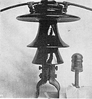 FIG. 12.-COMPARATIVE VIEW OF MAIN LINE AND TELEPHONE INSULATORS.