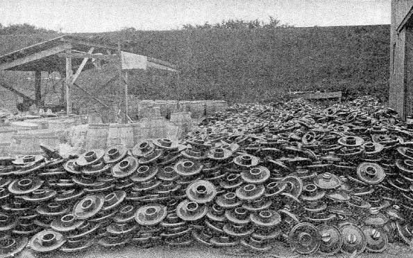 FIG. 2.  A PILE OF 20,000 INSULATORS WEIGHING 12 POUNDS EACH.