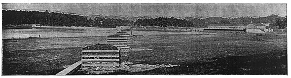 FIG. 12.  VIEW OF THE POWER HOUSE, SHOWING BOOM AND CRIB TO ARREST FLOATING REFUSE.
