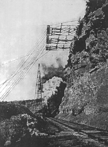 NEW NIAGARA TRANSMISSION LINE CARRIED BY CANTILEVER ARMS ON NEW YORK BANK OF NIAGARA RIVER OVER RAILROAD TRACK.