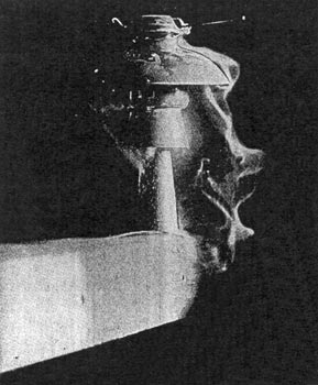 Fig. 2. Arcing Over an Insulator During a Rain Test at 40,000 Volts./HIGH-TENSION INSULATORS AND METHODS OF TESTING.