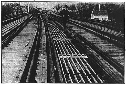 A VIEW OF THE CURVE CONSTRUCTION SHOWING THE USE OF SPLIT-SPOOL INSULATORS AND VITRIFIED CLAY SUPPORTS.